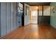 Spacious room with hardwood floors, open access to the sunroom at 5520 Hearn Rd, Ellenwood, GA 30294