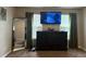 Bedroom featuring modern decor with mounted television and large mirror creates a calming space at 220 Cameron Ways, Covington, GA 30016
