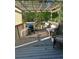 Inviting backyard deck with comfortable seating and grill, perfect for outdoor entertaining at 220 Cameron Ways, Covington, GA 30016