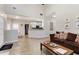 Bright living room boasts neutral walls, wood floors, and a cozy seating area at 220 Cameron Ways, Covington, GA 30016