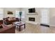 Comfortable living room featuring a fireplace, wood floors, and ample seating at 220 Cameron Ways, Covington, GA 30016
