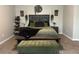 Cozy main bedroom features a comfortable bed, stylish decor, and a peaceful ambiance at 220 Cameron Ways, Covington, GA 30016