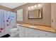 Bathroom with white vanity, floral shower curtain, and neutral paint at 4508 Club House Dr, Marietta, GA 30066