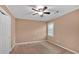 Bedroom with ceiling fan, window and neutral colored carpet at 4508 Club House Dr, Marietta, GA 30066