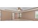 Bedroom features a tray ceiling, ceiling fan, carpet floors, and neutral colored walls at 4508 Club House Dr, Marietta, GA 30066