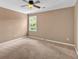 Bedroom with neutral walls, ceiling fan, and large window at 4508 Club House Dr, Marietta, GA 30066