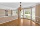 Traditional dining room with hardwood floors, beautiful chandelier, and natural light from the large windows at 4508 Club House Dr, Marietta, GA 30066