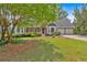 Beautiful brick home with mature trees and well-maintained lawn at 4508 Club House Dr, Marietta, GA 30066