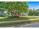 Well-maintained home with mature trees and a neatly manicured lawn at 4508 Club House Dr, Marietta, GA 30066