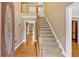 Inviting foyer with hardwood floors and staircase leading to the second level at 4508 Club House Dr, Marietta, GA 30066