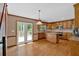 Bright kitchen with stainless appliances, granite counters, central island, and hardwood floors looking onto deck at 4508 Club House Dr, Marietta, GA 30066