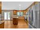 Modern kitchen featuring stainless steel appliances, granite counters, center island, and custom wood cabinets at 4508 Club House Dr, Marietta, GA 30066