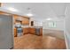 Bright kitchen with stainless steel appliances and wood cabinets open to a carpeted area at 4508 Club House Dr, Marietta, GA 30066