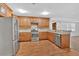 Updated kitchen with stainless steel appliances, wood cabinets, and modern countertops at 4508 Club House Dr, Marietta, GA 30066