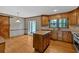 Spacious kitchen with granite counters, center island, stainless sink, and plenty of custom wood cabinetry at 4508 Club House Dr, Marietta, GA 30066