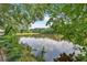 Scenic view of lake, reflecting sky and trees, creating a tranquil setting at 4508 Club House Dr, Marietta, GA 30066