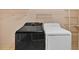 Laundry area with a black washer and a white dryer at 4508 Club House Dr, Marietta, GA 30066