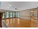 Large living room with hardwood floors, many windows, and brick fireplace at 4508 Club House Dr, Marietta, GA 30066
