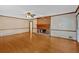 Open living room with hardwood floors and brick fireplace at 4508 Club House Dr, Marietta, GA 30066