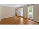 Light-filled living room with hardwood floors, crown molding, and windows at 4508 Club House Dr, Marietta, GA 30066