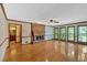 Spacious living room with hardwood floors, brick fireplace, and large windows at 4508 Club House Dr, Marietta, GA 30066