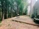 Back deck perfect for entertaining, featuring a wooded backdrop and grill at 4590 Galleon Xing, Decatur, GA 30035