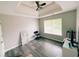 Bedroom with new flooring, ceiling fan and tray ceiling at 4590 Galleon Xing, Decatur, GA 30035