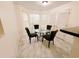 Bright dining area features a glass table, upholstered chairs, and natural light at 4590 Galleon Xing, Decatur, GA 30035