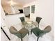 Cozy dining area with a glass table and four upholstered chairs at 4590 Galleon Xing, Decatur, GA 30035