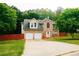 Charming two-story brick home with a two-car garage and a well-manicured lawn at 4590 Galleon Xing, Decatur, GA 30035