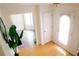Bright foyer showcasing wood floors, a plant, and easy access to adjacent living spaces at 4590 Galleon Xing, Decatur, GA 30035