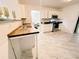 Modern kitchen features stainless steel appliances, wood countertops, and white cabinets at 4590 Galleon Xing, Decatur, GA 30035