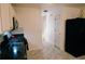Clean kitchen area with stainless appliances, dark countertops and access to the staircase at 4590 Galleon Xing, Decatur, GA 30035