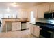 Spacious kitchen with white cabinets, stainless steel appliances, and butcher block countertop space at 4590 Galleon Xing, Decatur, GA 30035