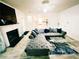 Bright living room with hardwood floors, fireplace, and large sectional sofa at 4590 Galleon Xing, Decatur, GA 30035