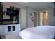 Serene bedroom with a television, fireplace, and ample natural light, offering a comfortable and stylish retreat at 4799 Winterview Ln, Douglasville, GA 30135