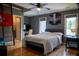 Bedroom boasts a ceiling fan, loft access ladder, and large windows at 4799 Winterview Ln, Douglasville, GA 30135