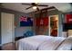 Bedroom features a ceiling fan, loft access ladder, and en-suite bathroom at 4799 Winterview Ln, Douglasville, GA 30135