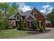 Beautiful brick home with manicured lawn and landscaping on a sunny day at 4799 Winterview Ln, Douglasville, GA 30135