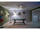 Game room with poker table, vintage gum ball machine, and neutral carpet at 4799 Winterview Ln, Douglasville, GA 30135