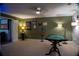 Game room with poker table, Steelers decor, and open access to living room at 4799 Winterview Ln, Douglasville, GA 30135