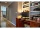 Hallway features hardwood floors, wooden desk, built-in shelving and natural light at 4799 Winterview Ln, Douglasville, GA 30135