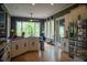 Bright kitchen with white cabinets, granite countertops, stainless steel appliances, and a large window overlooking a green landscape at 4799 Winterview Ln, Douglasville, GA 30135