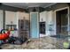 Well-equipped kitchen featuring granite countertops, stainless steel appliances, and ample cabinet space for efficient storage at 4799 Winterview Ln, Douglasville, GA 30135