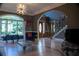 Stylish living room with large arched window, hardwood floors, and modern decor at 4799 Winterview Ln, Douglasville, GA 30135