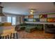 Open concept living space with breakfast bar, tile flooring, and ample seating at 4799 Winterview Ln, Douglasville, GA 30135