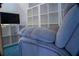 Living room showcasing cozy seating, plush carpeting, and built-in shelving at 4799 Winterview Ln, Douglasville, GA 30135