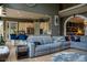 Open-concept living room with kitchen view, hardwood floors, and modern furnishings at 4799 Winterview Ln, Douglasville, GA 30135
