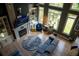 Bright living room boasts a fireplace, hardwood floors and abundant natural light through large windows at 4799 Winterview Ln, Douglasville, GA 30135