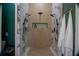 Sleek, modern shower with dual shower heads, marble accents, and built-in niche, perfect for a luxurious experience at 4799 Winterview Ln, Douglasville, GA 30135